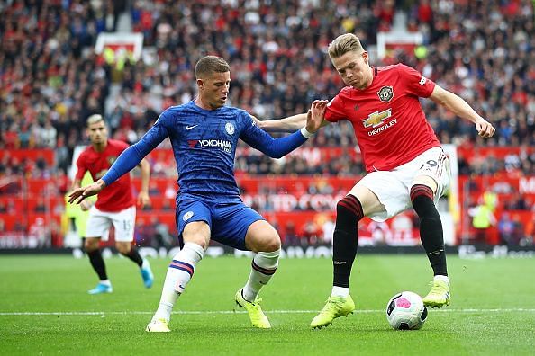 Chelsea's Ross Barkley contends for the ball with United's Scott McTominay